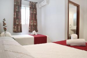Postel nebo postele na pokoji v ubytování Hostal Victoria