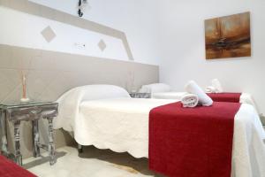 Postel nebo postele na pokoji v ubytování Hostal Victoria