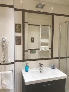 a bathroom with a sink and a mirror at Aquila house in Catania