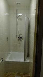 a shower in a bathroom with a bath tub at Ferien auf dem Bauernhof in Moosbach