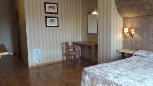 Posteľ alebo postele v izbe v ubytovaní Hotel Juan Carlos I