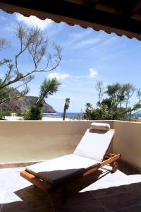 a bed on a porch with a view of the ocean at Casa Julia atico vistas playa Las Teresitas in Santa Cruz de Tenerife