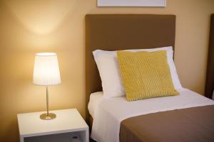 A bed or beds in a room at Il Nido del Gabbiano