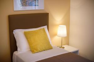 A bed or beds in a room at Il Nido del Gabbiano
