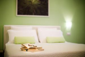 A bed or beds in a room at Il Nido del Gabbiano