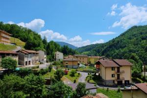 a small town in the mountains with houses at La casa di Nonna Nilla in San Giovanni Bianco