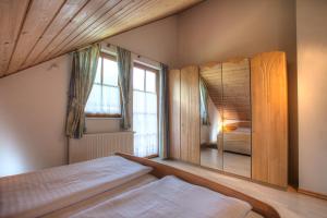 Postel nebo postele na pokoji v ubytování Ferienhaus Christina & Haus Dr. Krainer