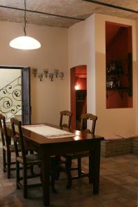 a dining room with a wooden table and chairs at B&B Dolce Casa in Vasto