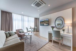 TV in/ali zabaviščno središče v nastanitvi Apartments & Rooms Preelook