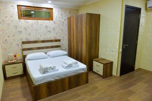 Postel nebo postele na pokoji v ubytování Hotel Lion