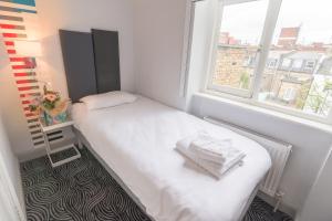 
Cama o camas de una habitación en Victoria Inn London
