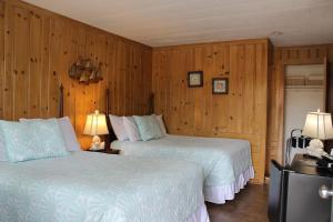 Voodi või voodid majutusasutuse Town & Beach Motel toas