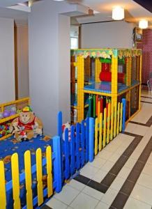 a childrens room with a play area with a toy at Hotel Rila in Dupnitsa