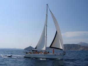 a group of people on a sail boat in the water at Hotel Eleni in Adamantas