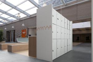 a row of lockers in a room with a building at easyHotel Amsterdam Zaandam in Zaandam