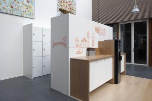 a room with lockers and a counter in a building at easyHotel Amsterdam Zaandam in Zaandam