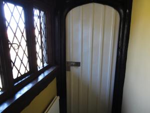 a door that is open in a small room at The Star And Eagle Hotel in Goudhurst