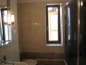 a bathroom with a shower and a sink and a toilet at Pokoje Gościnne Lawenda in Sandomierz +28 photos