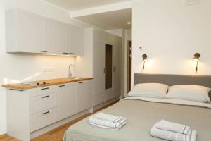Voodi või voodid majutusasutuse OldTown Tartu Apartments toas