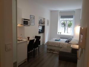 Posteľ alebo postele v izbe v ubytovaní Haustor Apartments