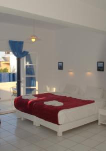 מיטה או מיטות בחדר ב-Porto Bello Hotel Apartments