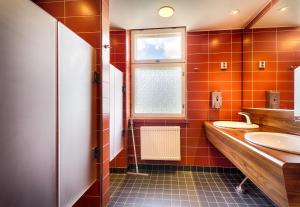 a bathroom with a sink and a window at Eurohostel in Helsinki