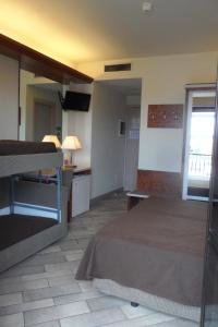 Postel nebo postele na pokoji v ubytování Hotel Eden