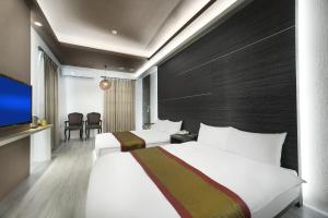 Letto o letti in una camera di One Fukun Hotel