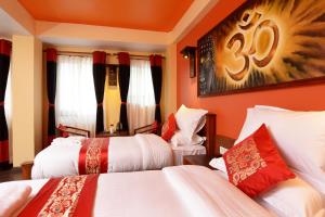 Letto o letti in una camera di Karma Boutique Hotel