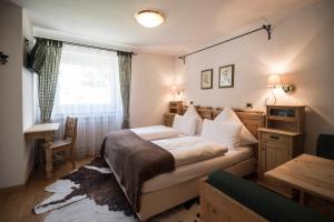 Letto o letti in una camera di Chalet Hotel Hartmann - Adults Only
