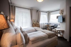 Letto o letti in una camera di Chalet Hotel Hartmann - Adults Only