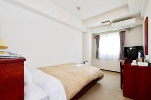 Postel nebo postele na pokoji v ubytování Sky Heart Hotel Koiwa