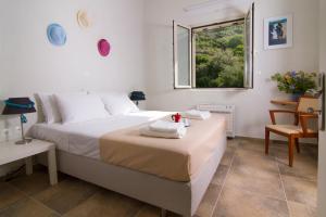 Ένα ή περισσότερα κρεβάτια σε δωμάτιο στο  Ploes Villas