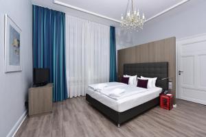 Postel nebo postele na pokoji v ubytování Frühlings-Hotel