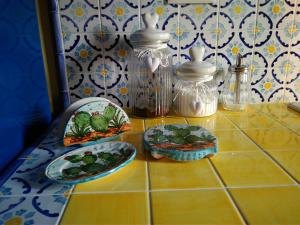 a table with three plates of food on it at La Maiolica B&B in Balestrate +15 photos