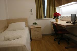 A bed or beds in a room at LSE Grosvenor House 