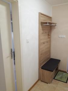 a room with a closet with a bench in it at Apartments Milena in Pinezici