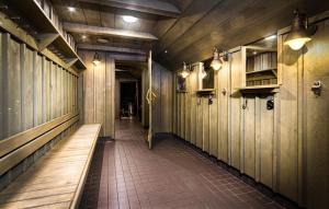 a hallway with wooden walls and a bench in a room at Eurohostel in Helsinki