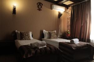  Кровать или кровати в номере Бутик-отель «Променадъ» 
