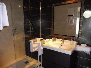 a bathroom with a sink and a shower at L'Eden de Floridylle in Xonrupt-Longemer +46 photos
