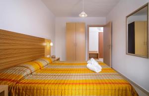 Ένα ή περισσότερα κρεβάτια σε δωμάτιο στο Apanemia by Flegra Hotels