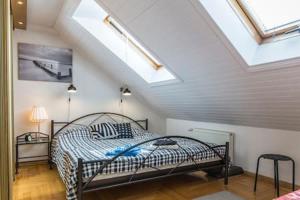 a bedroom with a bed in a attic at Old Riga Romantic Loft in Riga