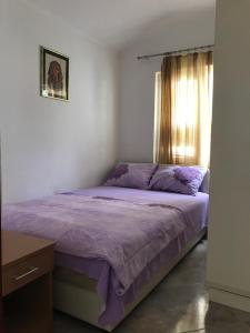 Postel nebo postele na pokoji v ubytování Apartments Pavićević