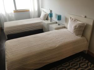 Posteľ alebo postele v izbe v ubytovaní Porta do Sol