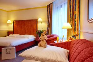 Postel nebo postele na pokoji v ubytování Hotel Concorde