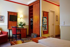 Postel nebo postele na pokoji v ubytování Hotel Concorde