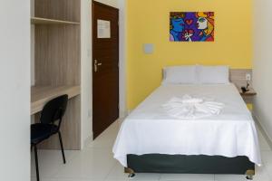 Posteľ alebo postele v izbe v ubytovaní Pojuca Plaza Hotel