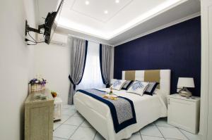Postel nebo postele na pokoji v ubytování B&B Maiori Luxury