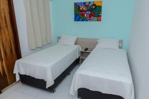 Posteľ alebo postele v izbe v ubytovaní Pojuca Plaza Hotel