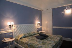 Letto o letti in una camera di Hotel Il Barocco